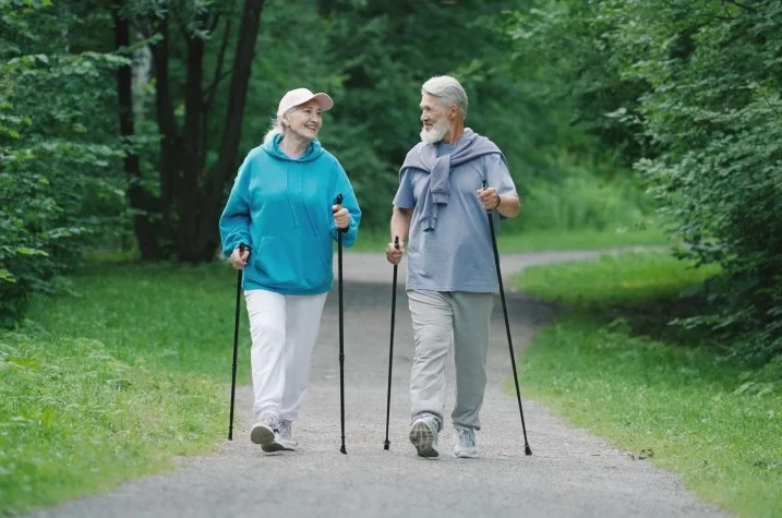 Old woman and man going for a walk